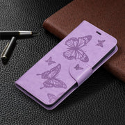 For Samsung Galaxy A02s (EU Version) Embossing Two Butterflies Pattern Horizontal Flip PU Leather Case with Holder & Card Slot & Wallet & Lanyard(Purple)