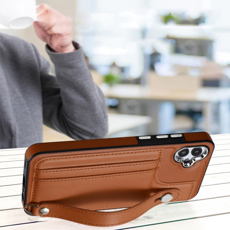 For Samsung Galaxy A04E / F04 / M04 Shockproof Leather Phone Case with Wrist Strap(Brown)