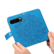 For Google Pixel 9 Pro 7-petal Flowers Embossing Leather Phone Case(Blue)
