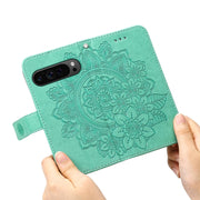 For Google Pixel 9 Pro Seven-petal Flowers Embossing Leather Phone Case(Green)