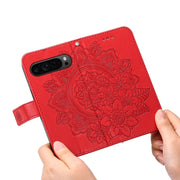 For Google Pixel 9 Pro 7-petal Flowers Embossing Leather Phone Case(Red)