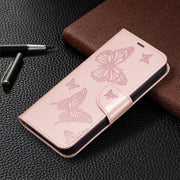 For iPhone 16 Plus Embossing Two Butterflies Pattern Leather Phone Case(Rose Gold)