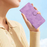 For iPhone 16 Flower Embossing Pattern Leather Phone Case(Purple)