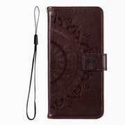 For iPhone 16 Pro Max Totem Flower Embossed Leather Phone Case(Brown)
