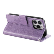 For iPhone 16 Pro Totem Flower Embossed Leather Phone Case(Purple)