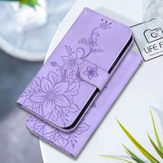 For Google Pixel 9 Lily Embossed Leather Phone Case(Purple)
