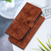 For Google Pixel 9 Lily Embossed Leather Phone Case(Brown)