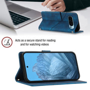For Google Pixel 9 / 9 Pro Skin-feel Embossed Leather Phone Case(Blue)