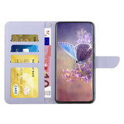 For Google Pixel 9 Pro Skin Feel Butterfly Embossed Flip Leather Phone Case(Purple)