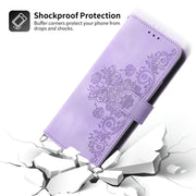 For Google Pixel 9 Pro Skin-feel Flowers Embossed Wallet Leather Phone Case(Purple)
