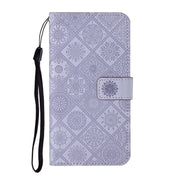 For Google Pixel 9 / 9 Pro Ethnic Style Embossed Pattern Leather Phone Case(Purple)