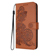 For Google Pixel 9 Pro Datura Flower Embossed Flip Leather Phone Case(Brown)