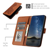 For Google Pixel 9 Datura Flower Embossed Flip Leather Phone Case(Brown)