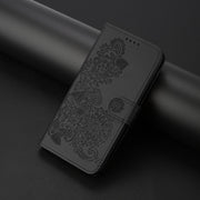 For iPhone 16 Plus Datura Flower Embossed Flip Leather Phone Case(Black)
