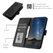 For iPhone 16 Plus Datura Flower Embossed Flip Leather Phone Case(Black)