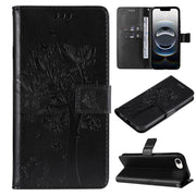 For iPhone 16e Tree & Cat Embossed Pattern Flip Leather Phone Case(Black)