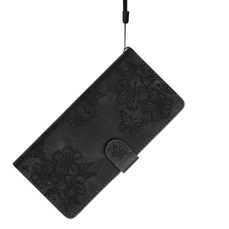 For iPhone 16e Cherry Blossom Butterfly Skin Feel Embossed PU Phone Case(Black)