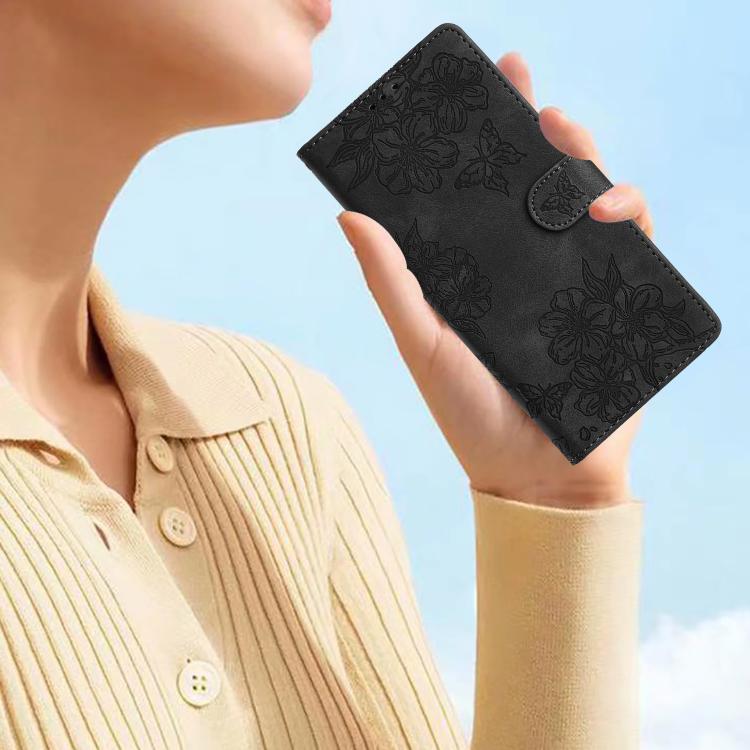 For iPhone 16e Cherry Blossom Butterfly Skin Feel Embossed PU Phone Case(Black)
