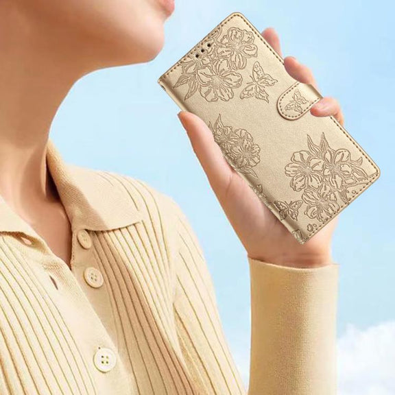 For iPhone 16e Cherry Blossom Butterfly Skin Feel Embossed PU Phone Case(Gold)