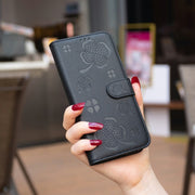 For Samsung Galaxy S25 Ultra 5G Four-leaf Embossed Leather Phone Case(Black)