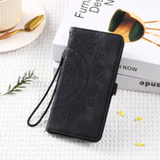 For iPhone 16 Skin Feel Totem Embossed Leather Phone Case(Black)