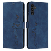 For Samsung Galaxy S25+ / S24+ 5G Skin Feel Heart Embossed Leather Phone Case with Long Lanyard(Blue)
