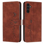 For Samsung Galaxy S25+ / S24+ 5G Skin Feel Heart Embossed Leather Phone Case with Long Lanyard(Brown)