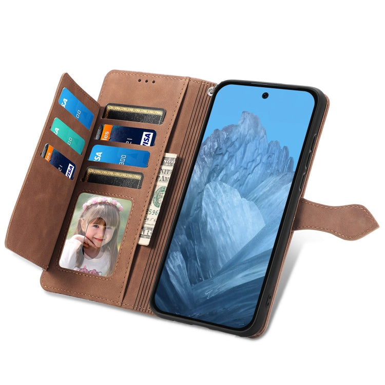 For Google Pixel 9 Embossed Flower Zipper Leather Phone Case(Brown)