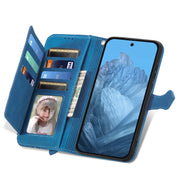 For Google Pixel 9 Embossed Flower Zipper Leather Phone Case(Blue)