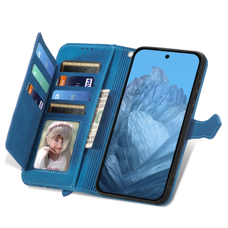 For Google Pixel 9 Embossed Flower Zipper Leather Phone Case(Blue)