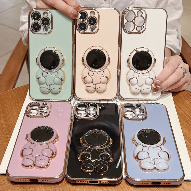 For iPhone 16 Embrace Stars Electroplating Astronaut Holder Phone Case(Black)