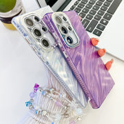 For Samsung Galaxy S25+ 5G Plating Glitter Texture Chain Wristband TPU Phone Case with Lens Film(Purple Shell Pattern)