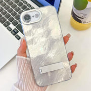 For iPhone 16e Plating Glitter Texture Fold Holder TPU Phone Case with Lens Film(White Tinfoil Texture)