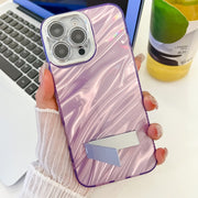 For iPhone 16 Plating Glitter Texture Fold Holder TPU Phone Case with Lens Film(White Tinfoil Texture)