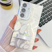 For Samsung Galaxy S25 5G Plating Glitter Texture Fold Holder TPU Phone Case with Lens Film(White Feathers)