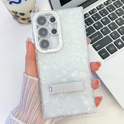 For Samsung Galaxy S25 Ultra 5G Plating Glitter Texture Fold Holder TPU Phone Case with Lens Film(White Shell Pattern)