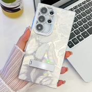 For Samsung Galaxy S25 Ultra 5G Plating Glitter Texture Fold Holder TPU Phone Case with Lens Film(White Feathers)