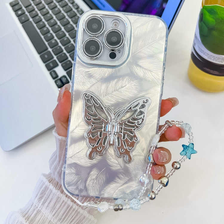 For iPhone 16 Pro Plating Glitter Lens Film Texture Butterfly Holder Wristband Phone Case(White Feathers)