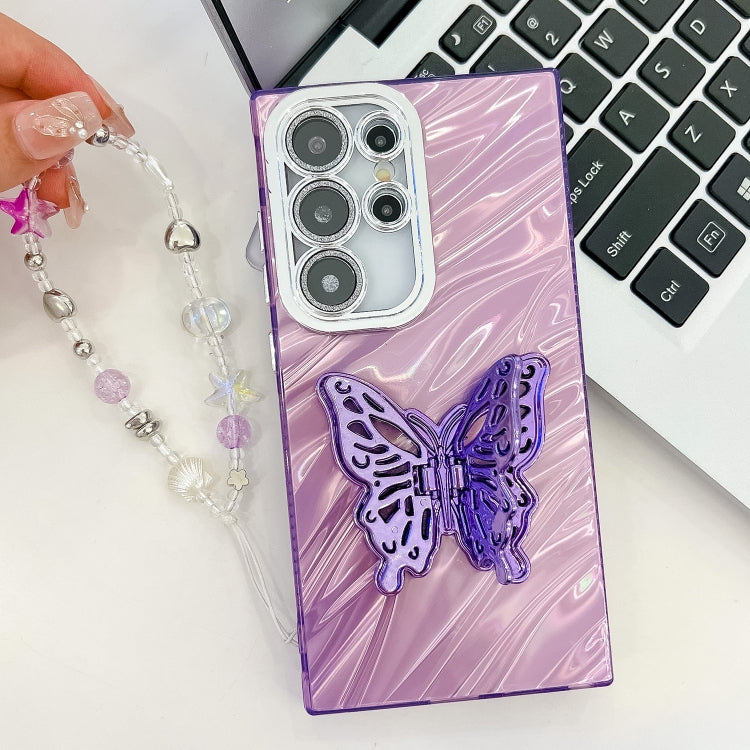 For Samsung Galaxy S25+ 5G Plating Glitter Lens Film Texture Butterfly Holder Wristband Phone Case(Pink Shell Pattern)