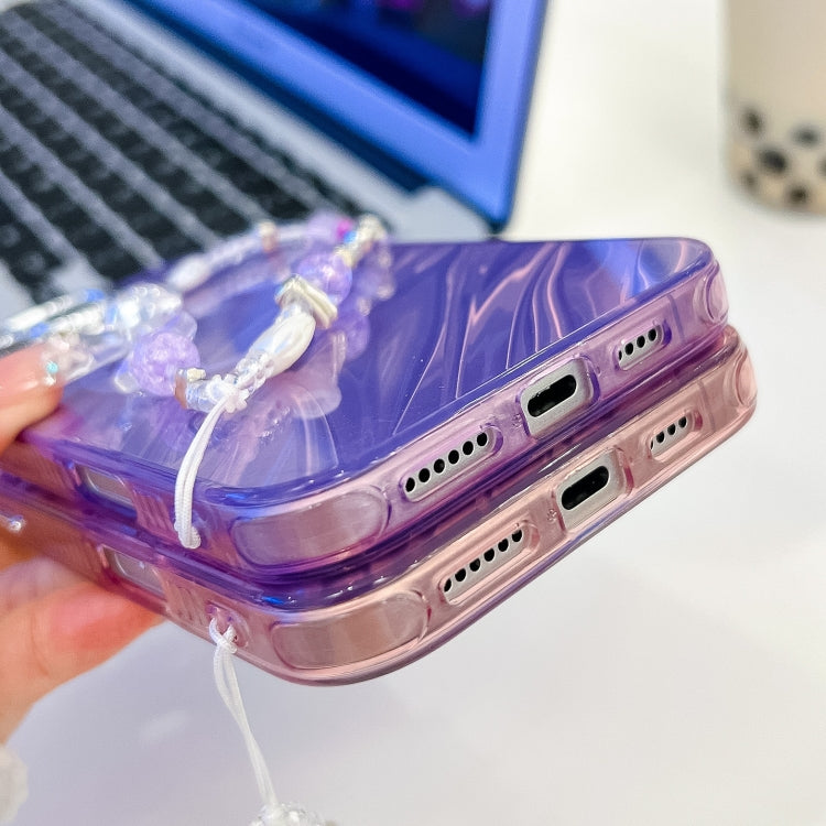 For iPhone 16 Pro Plating Texture Wristband MagSafe TPU Phone Case with Glitter Lens Film(Purple Tinfoil Texture)