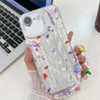 For iPhone 16e Electroplating Flower Texture Wristband TPU Phone Case(Purple Wildflowers SH1) - iPhone 16e Cases by PMC TechLife | Online Shopping South Africa | PMC TechLife | Buy Now Pay Later Mobicred