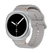 For Samsung Galaxy Watch8 40mm Rhombic Texture Bezel and Wavy Grain Stitched Color Buckle Silicone Watch Band(Gray Silver)