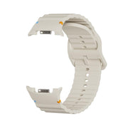 For Samsung Galaxy Watch8 40mm Speed Bezel and Wavy Grain Stitched Color Buckle Silicone Watch Band(Beige Black)