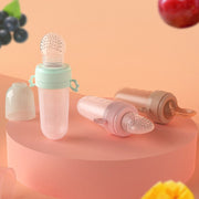 Portable Dual-purpose Baby Food Feeding Spoon Fruit Vegetable Silicone Feeding Pacifier Bottle(Pink)